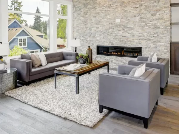 living room with fireplace and grey furniture