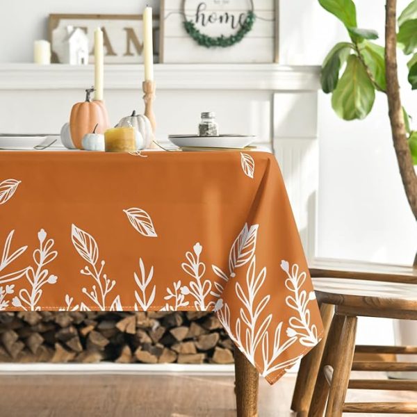 a table with fall linens set for a meal