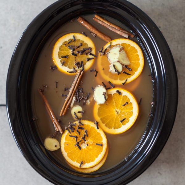 slow cooker filled with mulled cider