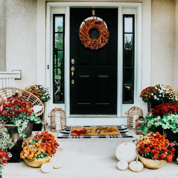 Front porch with mums and pumpkins