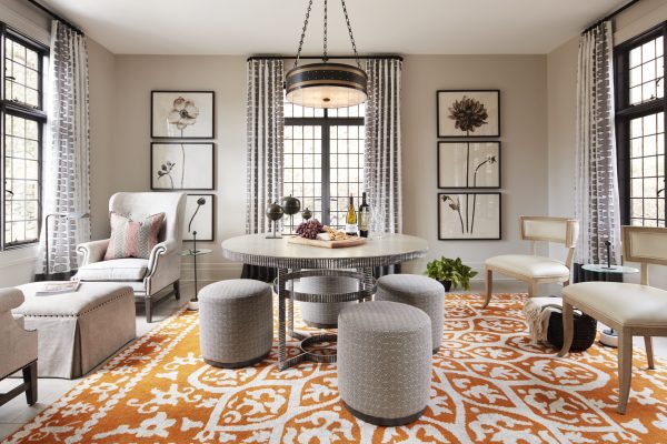 grey living room with orange rug