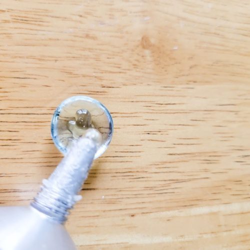 Coastal-Vase-Gems-Glue-Single-1448 First, make sure that all your glass surfaces are clean and dry (remove any labels and label residue with warm, soapy water). Put Gorilla Glue on the flat side of your glass gem.