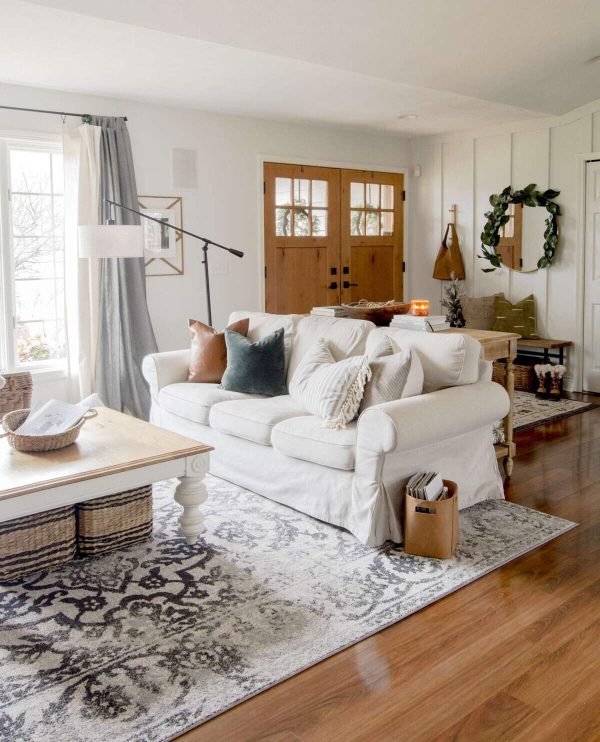 living room with hardwood floors white furniture and area rug people with cozy homes know