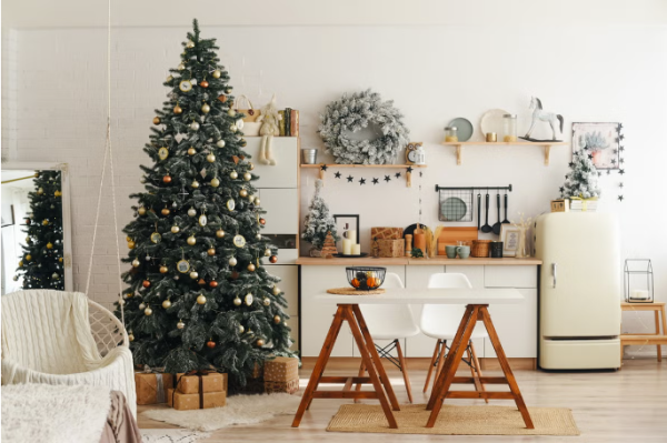 A white room with a large Christmas tree a beautifully decorated Christmas home