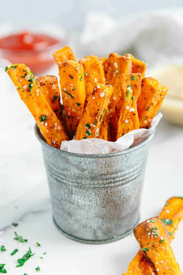 a small metal bucket of sweet potato fries