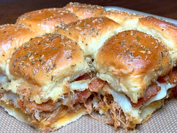 golden buns filled with pulled pork on a plate dinner recipes for a crowd