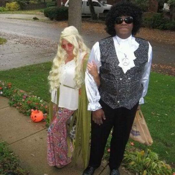 man and woman dressed as hippies