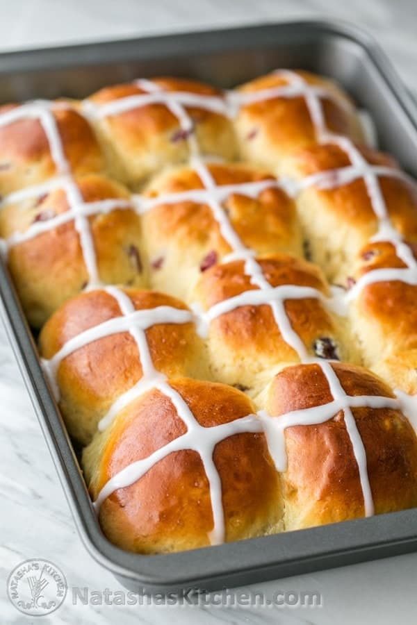 pan of rolls with white icing crosses on top recipes perfect for Easter dinner