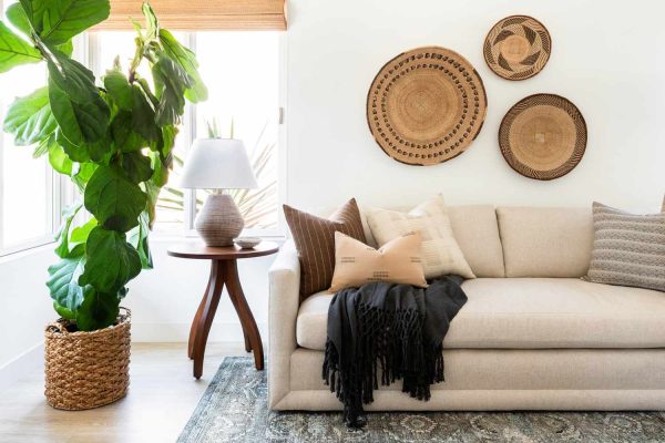 living room with white sofa and large circle accessories on the wall