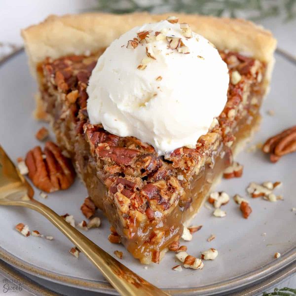 a slice of maple pecan pie with vanilla ice cream on a white plate fabulous fall desserts