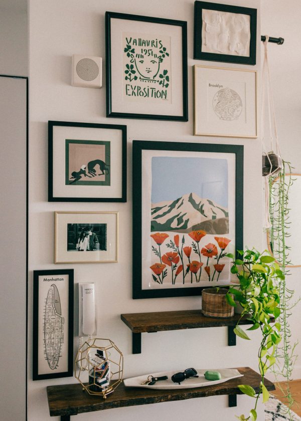 a gallery wall on a white surface make your entryway more inviting