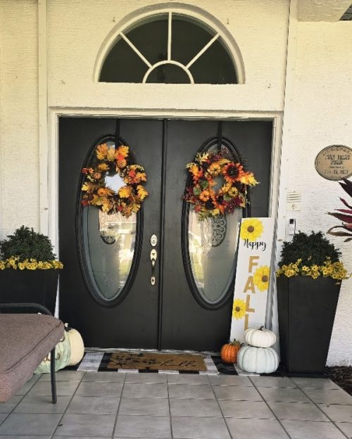a picture of a front porch decorated for fall