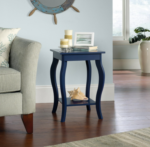 a blue side table with curvy legs in a living room going coastal for under $100