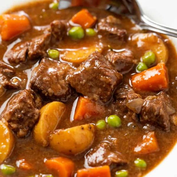 beef stew with carrots, potatoes and peas