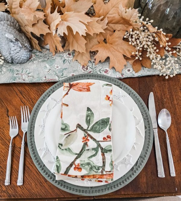 Place setting with floral napkin and silverware