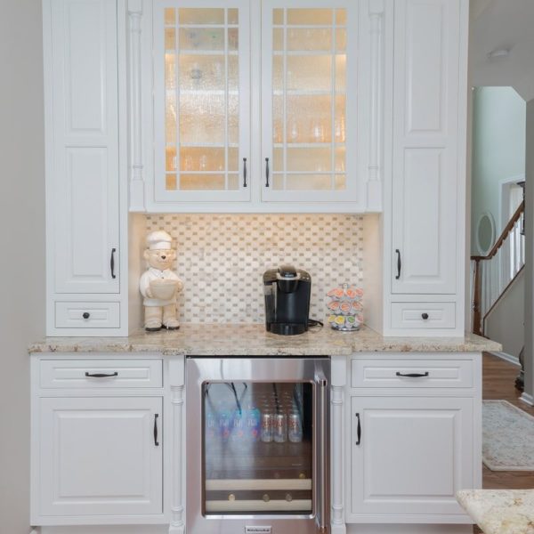 White kitchen cabinets with a beverage center