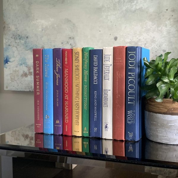 a router cover that looks like a set of books hide the ugly in your home