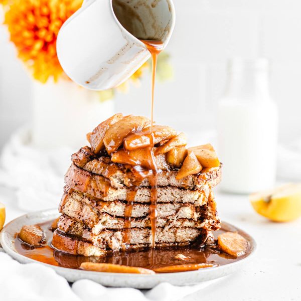 apple cinnamon french toast with syrup drizzled on top