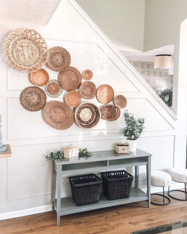 many baskets hanging on a staircase wall useful ideas for decorating with baskets