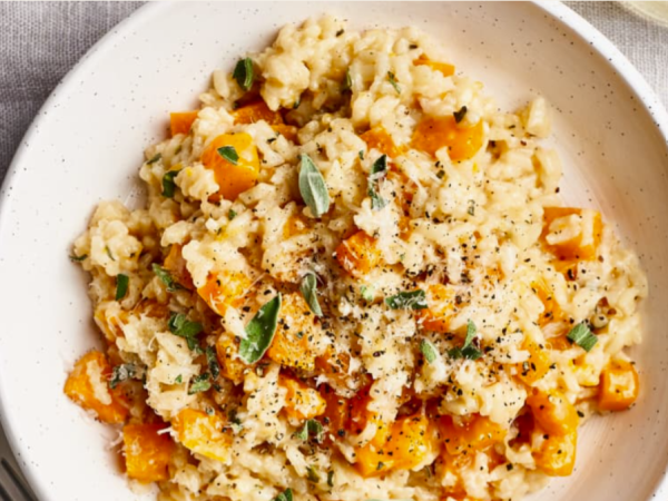 a white dish of butternut squash risotto with sage great fall side dishes