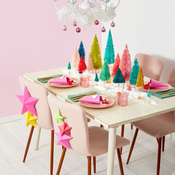multi-color bottle brush trees on a table