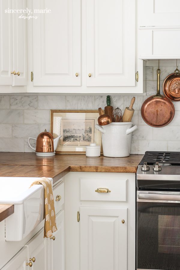 wooden kitchen countertop with framed art