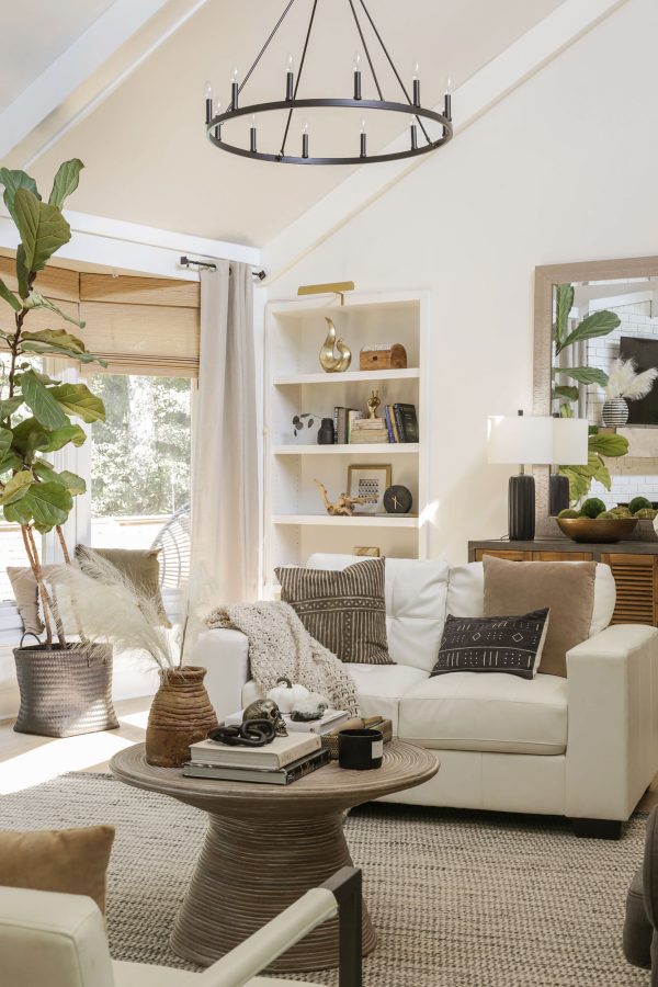 white living room with fall pillows and tall plants minimalist fall decor ideas