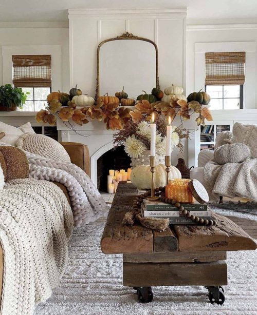 Fall living room with a chunky knit blanket and fireplace