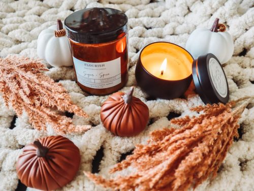 Fall inspired candles on a chunky blanket