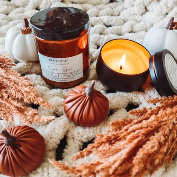 Fall inspired candles on a chunky blanket