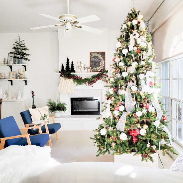 white living room with fireplace and Christmas tree