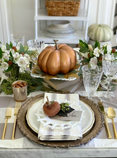 pumpkin tablescape with white china
