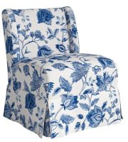 slipcovered blue and white armless chair