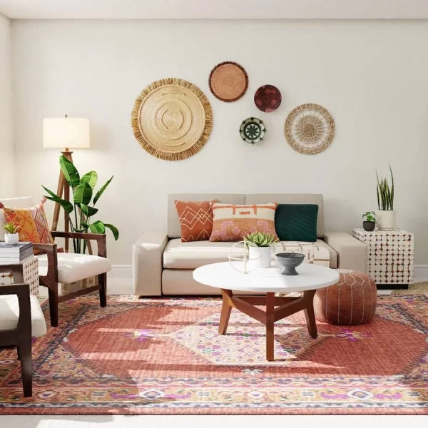 White living room with red rug 2 chairs and a sofa