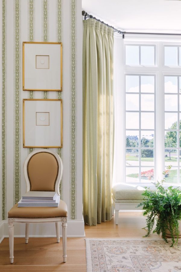 living room with green stripped wallpaper and green curtains add more spring colors to your home.