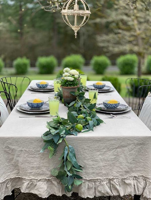 outdoor dining table with greenery and lemons table runner creative outdoor table decor