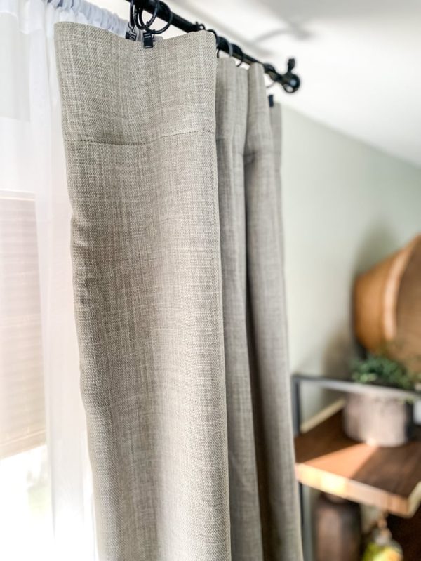 linen curtains hanging on a window transition your living space from spring to summer