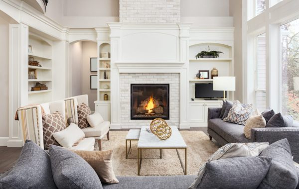 white living room with fireplace and coffee table designer secrets for a room that stays in style