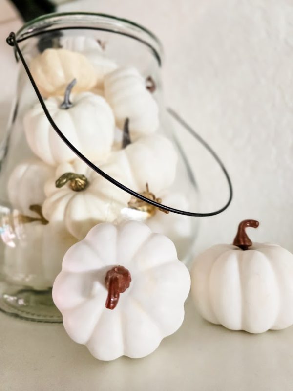 white pumpkins in a glass jar