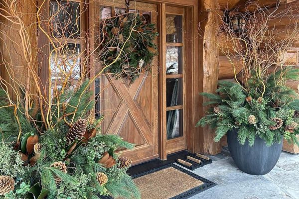 front porch with large planters and wreath on the front door decorate your porch for winter